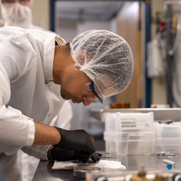 Person doing research in a lab wearing PPE 